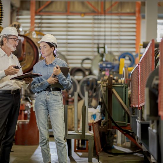 A new generation of engineers in a metal sheet factory.  Studying work methods from supervisors or colleagues and studying by yourself  be taught professionally