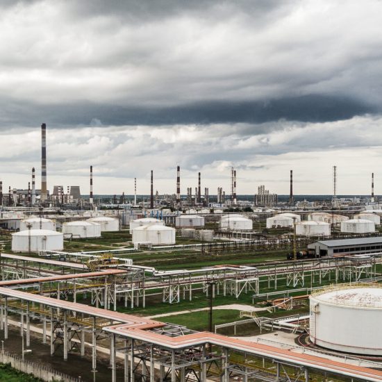 Aerial view of huge oil refinery with smokestacks and tanks